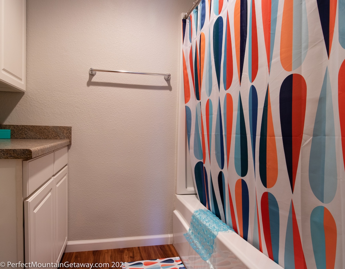 The Hall Bathroom is alive with pops of color in keeping with our Mid Century Modern Design.
